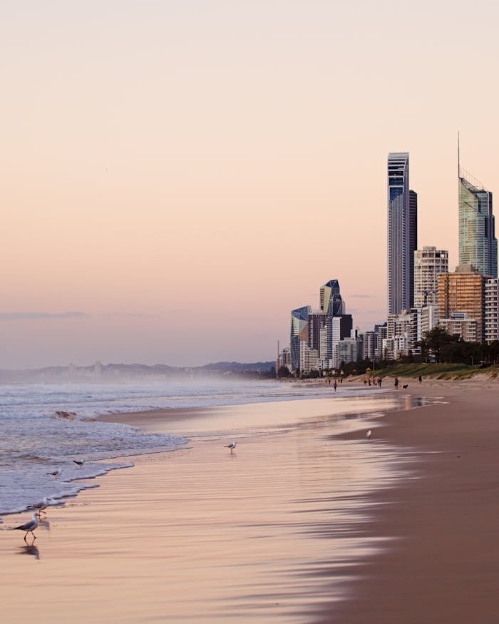 our-story Serene beach view of Surfers Paradise skyline at twilight, Queensland, Australia.